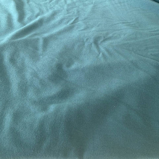 Soft bamboo knit fabric with a smooth, stretchy texture and excellent drape.