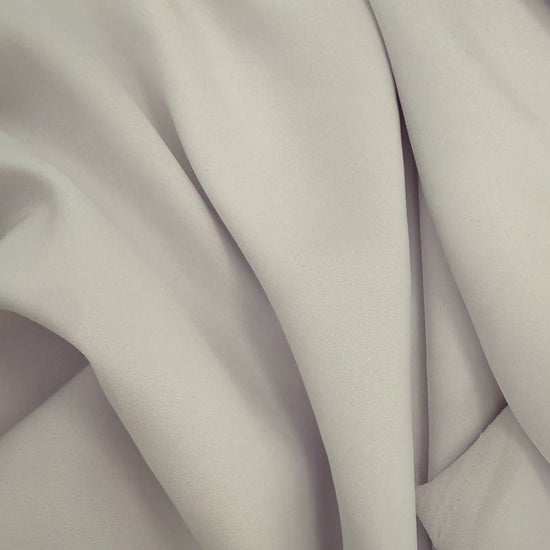 White dress crepe fabric with soft drape and matte finish 
