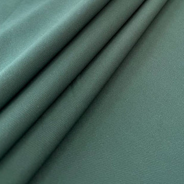 Green crepe suit fabric with matte finish and soft structured drape 