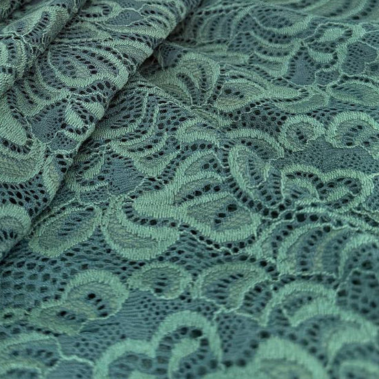 Elegant fancy lace fabric with a delicate floral pattern and soft stretch