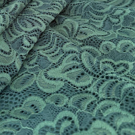 Elegant fancy lace fabric with a delicate floral pattern and soft stretch