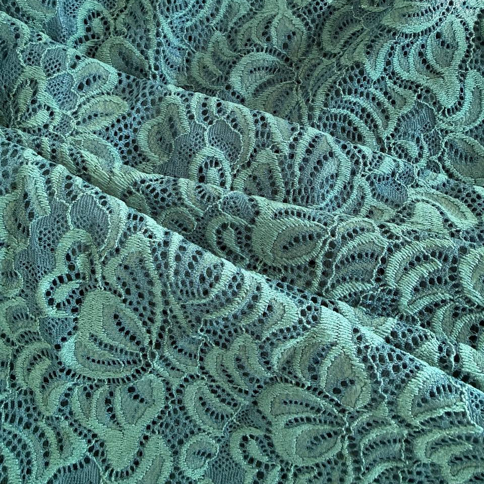 Green fancy lace fabric with floral pattern and soft stretch