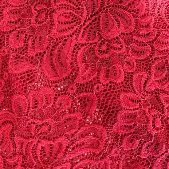 Elegant fancy lace fabric with a delicate floral pattern and soft stretch. 