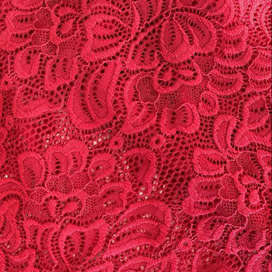 Elegant fancy lace fabric with a delicate floral pattern and soft stretch. 