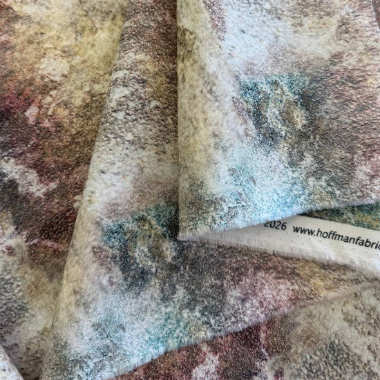 Hoffman Stag and Stone Dune digitally printed quilting cotton fabric with soft beige, mauve, and earthy stone texture pattern.
