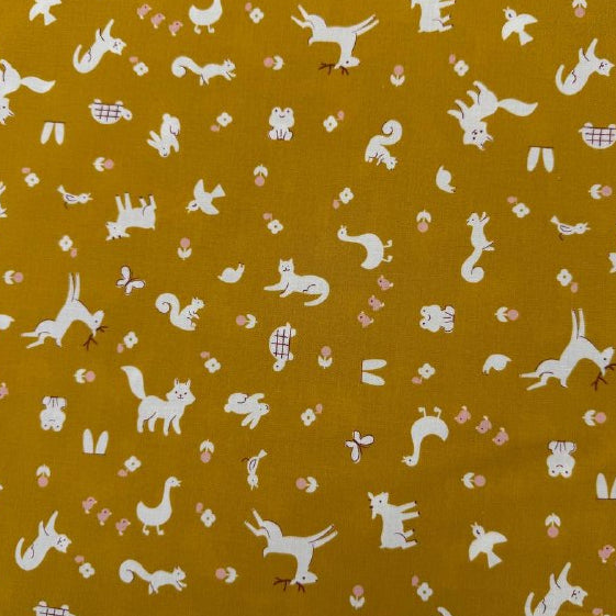 Mustard yellow Woodland Park cotton fabric with white woodland animals and floral print by Ruby Star Society