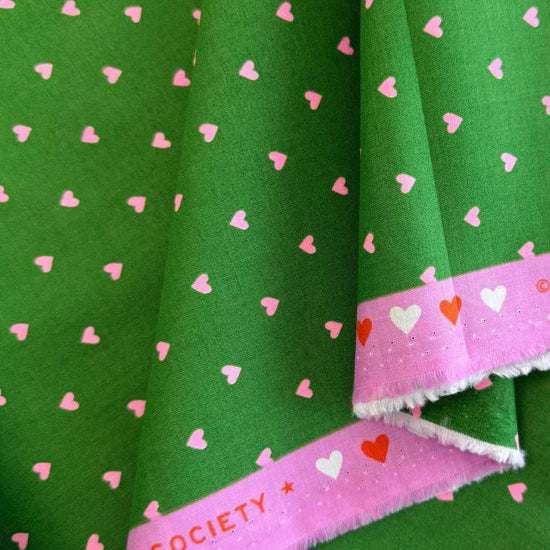 Trinketry hearts cotton fabric by Melody Miller for Ruby Star Society in multiple colors with tiny scattered heart print.