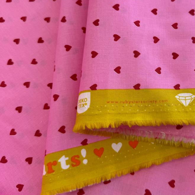Trinketry hearts cotton fabric by Melody Miller for Ruby Star Society in multiple colors with tiny scattered heart print.