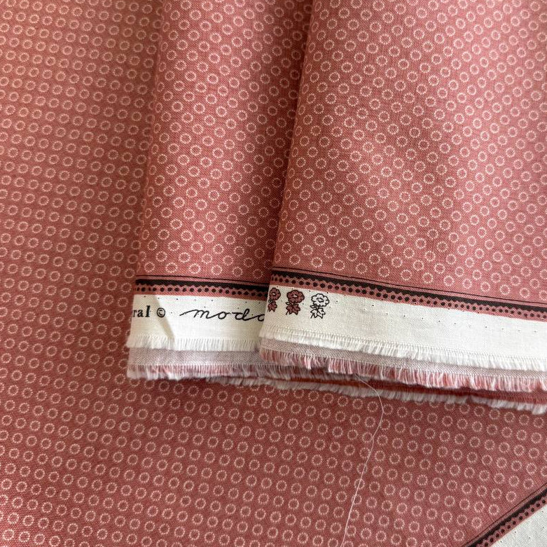 Joie De Vivre clay pink cotton fabric with small white dot circle print by French General for Moda.