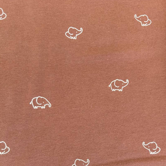 Brown cotton jersey knit fabric with small white elephant print.