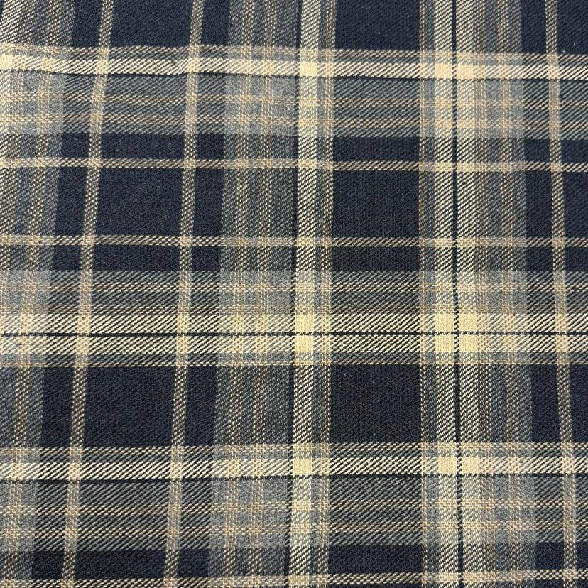 Double-sided yarn-dyed plaid fabric in navy, grey and beige, made from 85% cotton and 15% polyester.