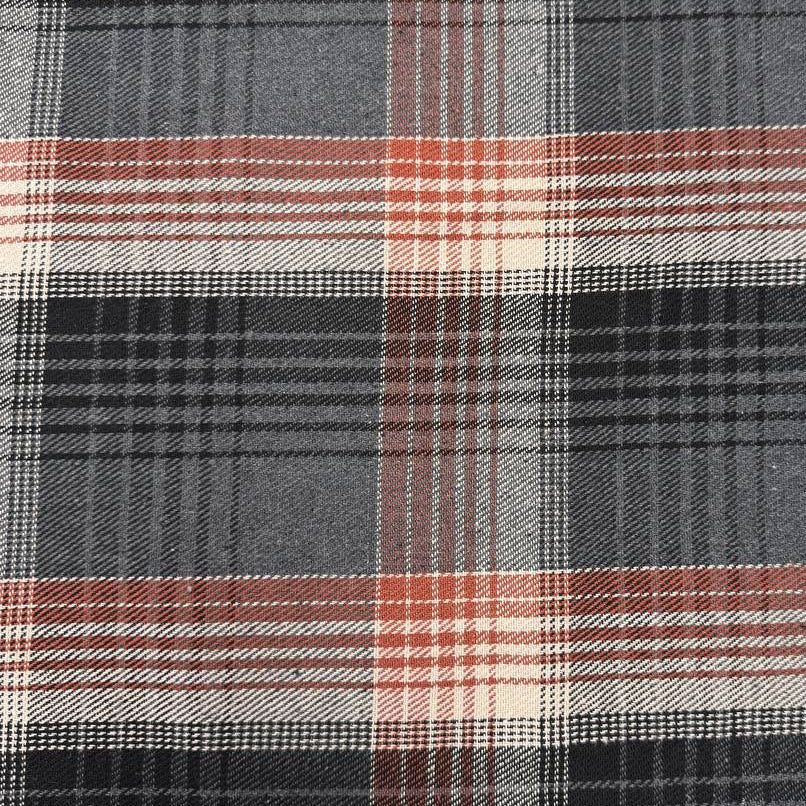 Black, grey, cream and rust double-sided plaid fabric with a classic yarn-dyed tartan pattern.