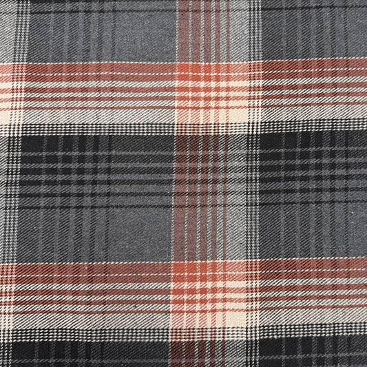 Black, grey, cream and rust double-sided plaid fabric with a classic yarn-dyed tartan pattern.