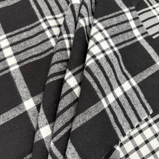Black and white double-sided yarn-dyed plaid fabric with a classic tartan pattern.