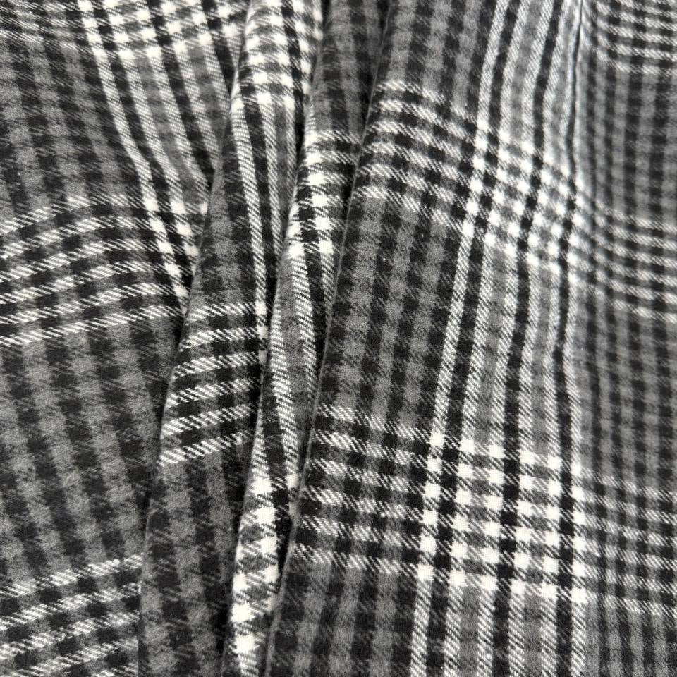 Black, grey and white double-sided yarn-dyed plaid fabric with a classic tartan pattern.
