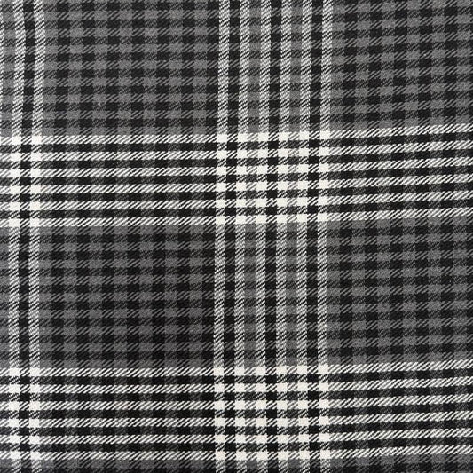 Black, grey and white double-sided yarn-dyed plaid fabric with a classic tartan pattern.