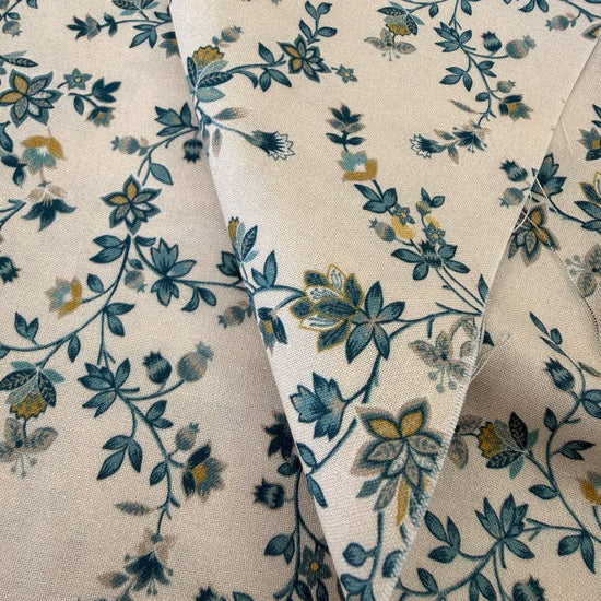 cream quilting cotton fabric with delicate blue and yellow floral vine pattern – Sasha’s Atelier Canada
