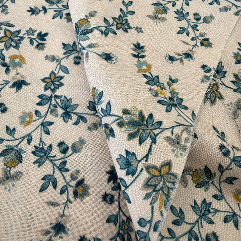 cream quilting cotton fabric with delicate blue and yellow floral vine pattern – Sasha’s Atelier Canada