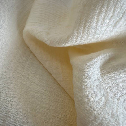 Soft and breathable 100% cotton double gauze fabric in a beautiful ivory shade. 