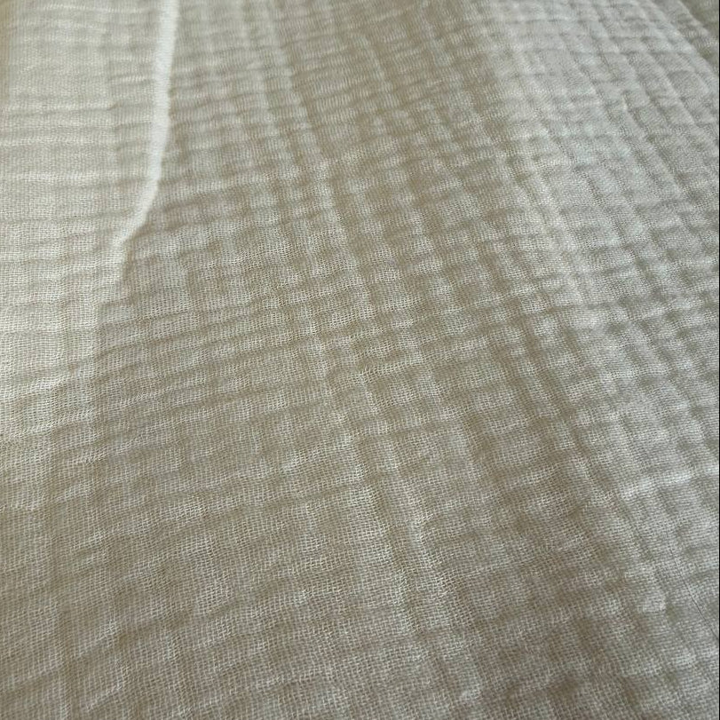 Soft and breathable 100% cotton double gauze fabric in a beautiful ivory shade. 