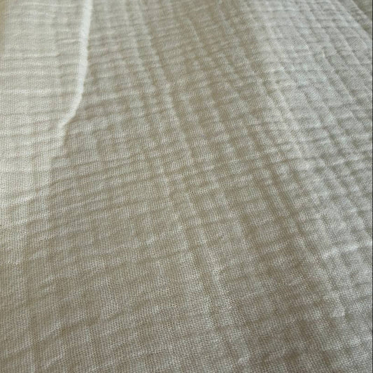 Soft and breathable 100% cotton double gauze fabric in a beautiful ivory shade. 