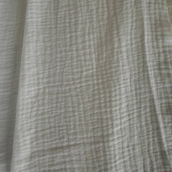 Soft and breathable 100% cotton double gauze fabric in a classic white shade