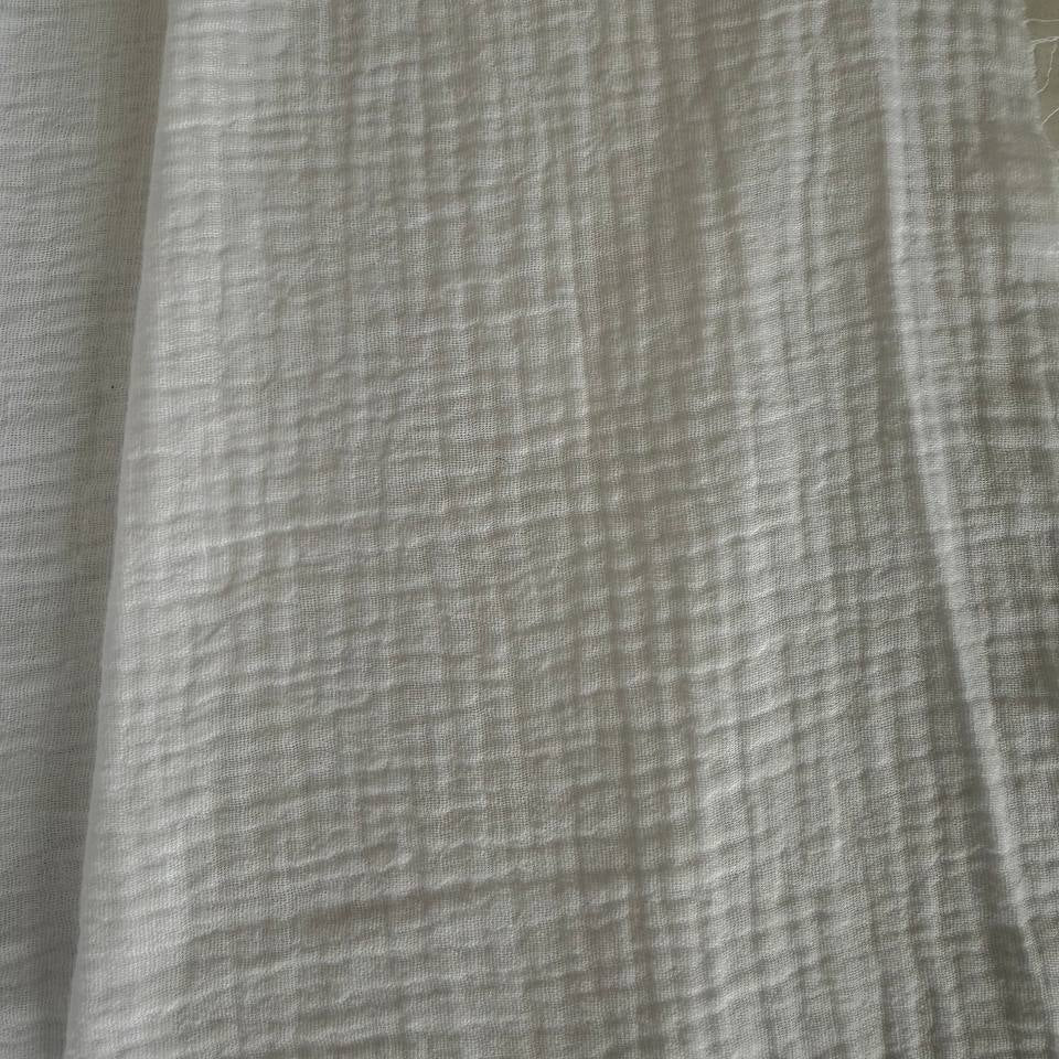 Soft and breathable 100% cotton double gauze fabric in a classic white shade