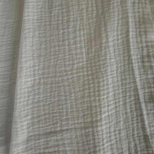 Soft and breathable 100% cotton double gauze fabric in a classic white shade