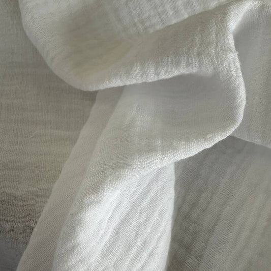 Soft and breathable 100% cotton double gauze fabric in a classic white shade