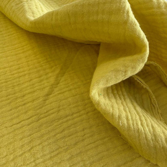 Fresh and vibrant double gauze fabric in a beautiful yellow green shade.