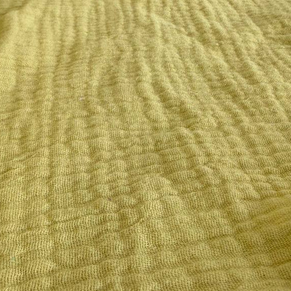 Fresh and vibrant double gauze fabric in a beautiful yellow green shade.