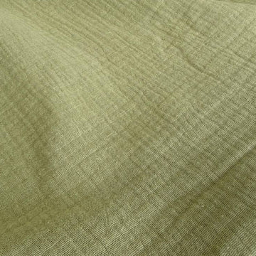 Elegant double gauze fabric in a soft sage green shade.