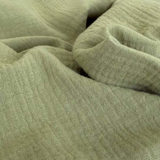 Elegant double gauze fabric in a soft sage green shade.