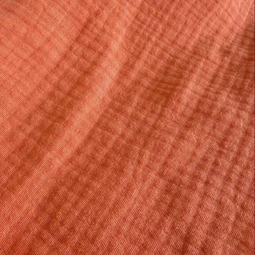 Beautiful double gauze fabric in a warm orange shade.