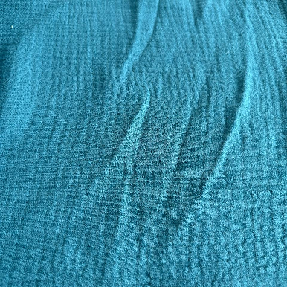 Soft and breathable double gauze fabric in a rich teal shade.