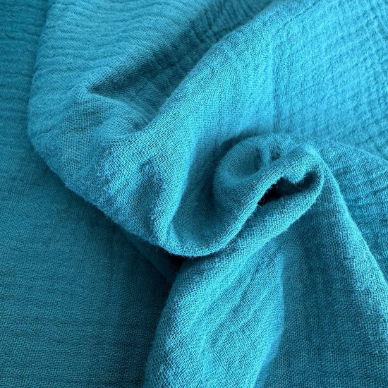 Soft and breathable double gauze fabric in a rich teal shade.