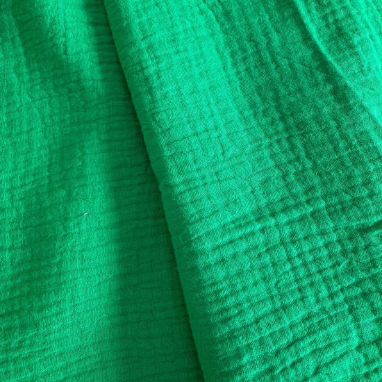 Soft and breathable double gauze fabric in a fresh green shade.