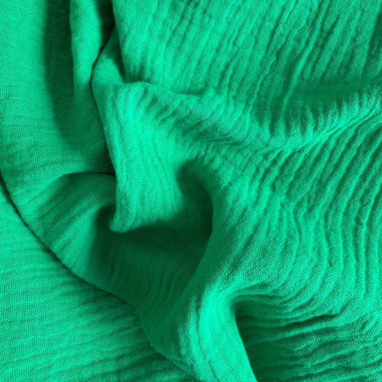 Soft and breathable double gauze fabric in a fresh green shade.