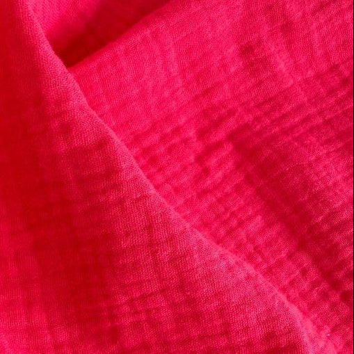 Soft and breathable double gauze fabric in a bright red shade.