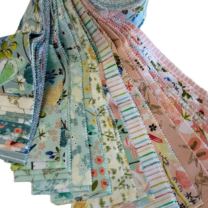 Serenity Blooms 2.5 inch precut fabric strips by Ginger Deverell for Poppie Cotton in soft pastel floral prints and coordinating designs.