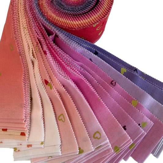 I Heart Ombre Metallic Jelly Roll by Moda Fabrics featuring 40 precut 2.5 inch cotton strips in pink, coral, and lavender ombré shades with metallic heart accents.