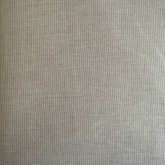 Soft and structured suiting fabric in a refined beige micro-check pattern.