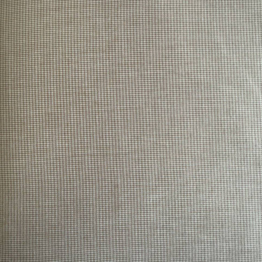 Soft and structured suiting fabric in a refined beige micro-check pattern.