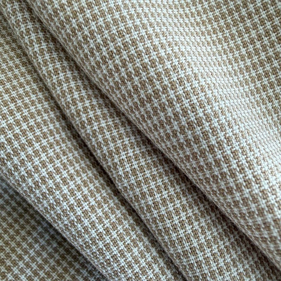 Soft and structured suiting fabric in a refined beige micro-check pattern.