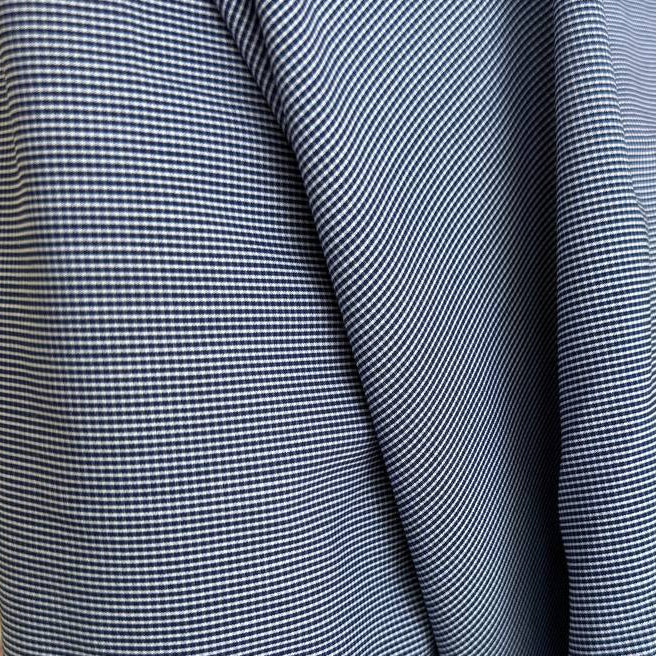 Classic striped shirting fabric in a timeless blue and white pattern.