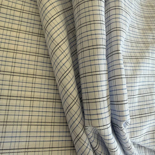 Lightweight shirting fabric in a refined blue micro check pattern.