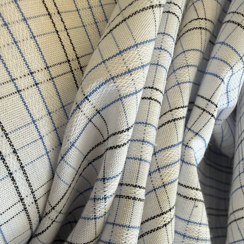 Lightweight shirting fabric in a refined blue micro check pattern.