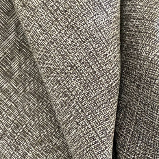 Structured suiting fabric in a refined grey textured weave.