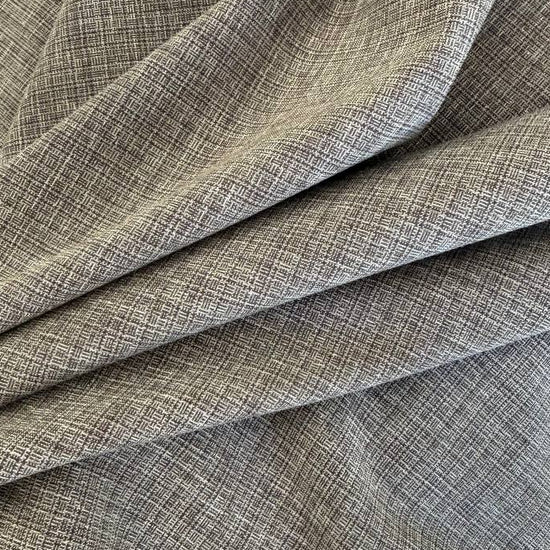 Structured suiting fabric in a refined grey textured weave.