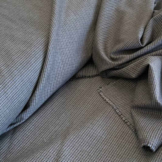 Refined suiting fabric in an elegant blue-grey micro check pattern.